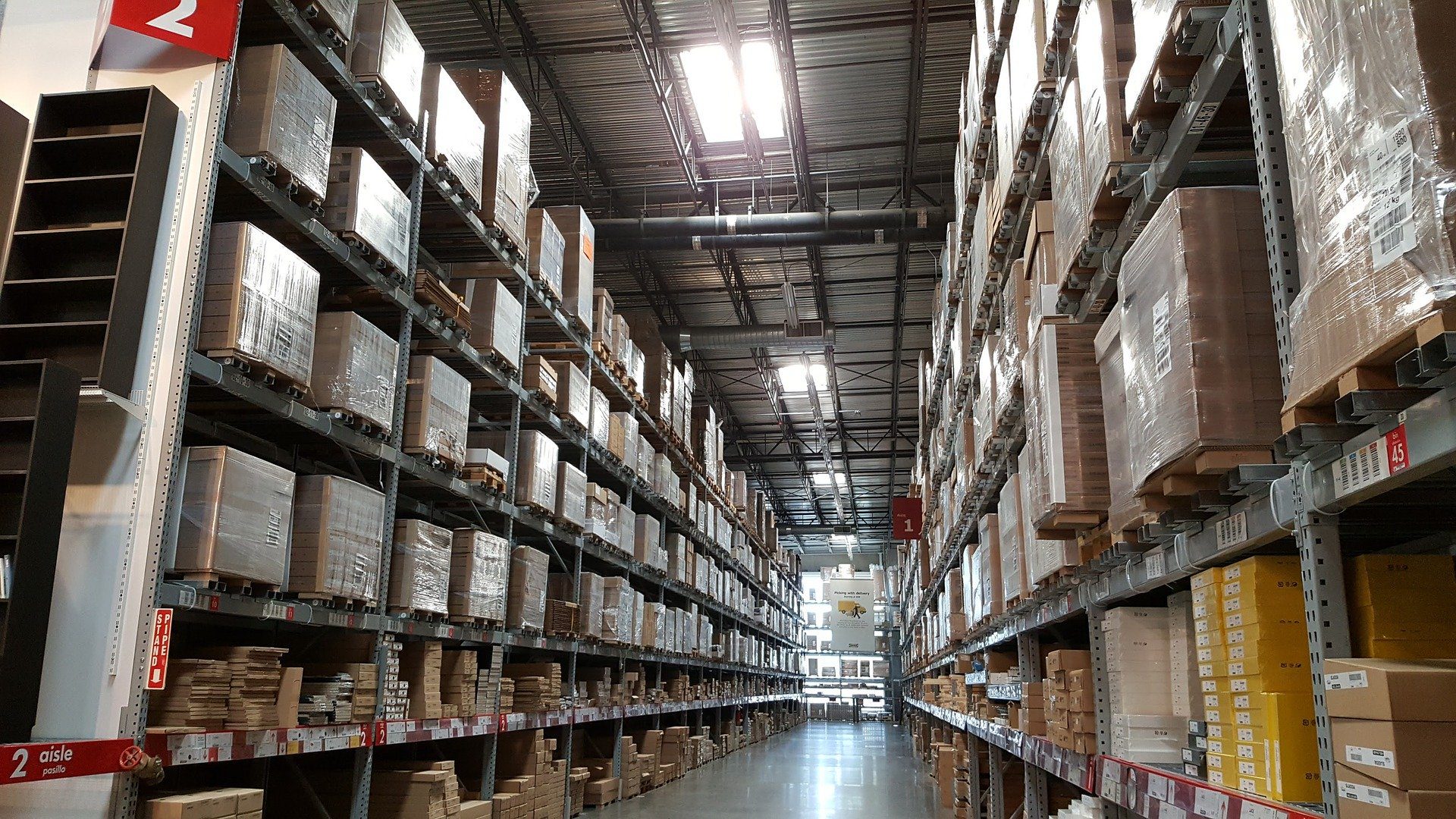Rows of shelves in a warehouse loaded with boxes
