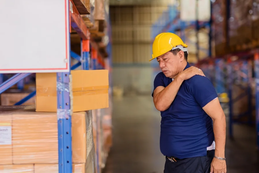 Warehouse worker with back pain