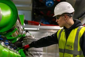 Industrial worker wearing helmet and protective equipment, representing physical abilities testing (PAT) and workplace safety evaluation in high-risk environments.