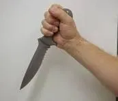 Dagger grip technique used for table cutting tasks to support a more neutral wrist position.